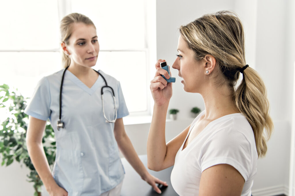An Asthma Woman with doctor at the hospital